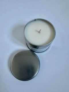 Tiny Tin Candle Co.'s homemade candle 'Banana Milkshake' soy candle, lit to infuse any room with its sweet, inviting fragrance. Top of candle with lid off