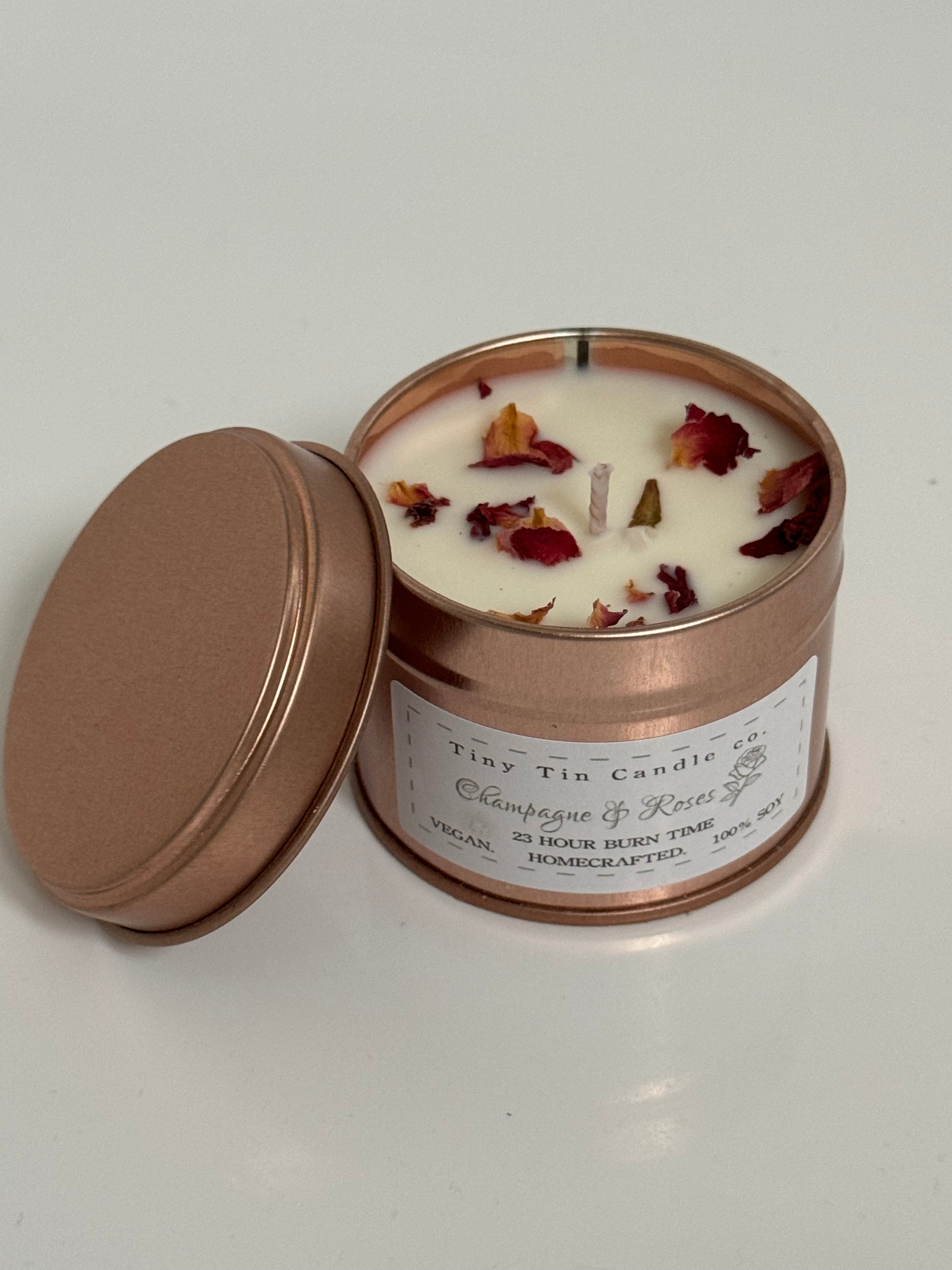 Homemade Candle Champagne & Roses Soy Tin Candle 100ml Tin, front and top of candle can be seen.