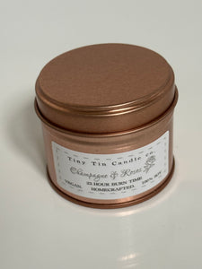 Homemade Candle Champagne & Roses Soy Tin Candle 100ml Tin. Front of candle shown with lid on,