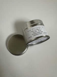 Homemade Candle Cosy Cashmere & Winter Musk 100ml Soy Tin Candle , Candle on side to show front and base of candle 