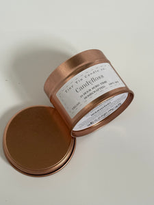 Homemade Candle Candy floss Soy Candle Tin 100ml , candle laying on the side to showcase the front and bottom of the tin