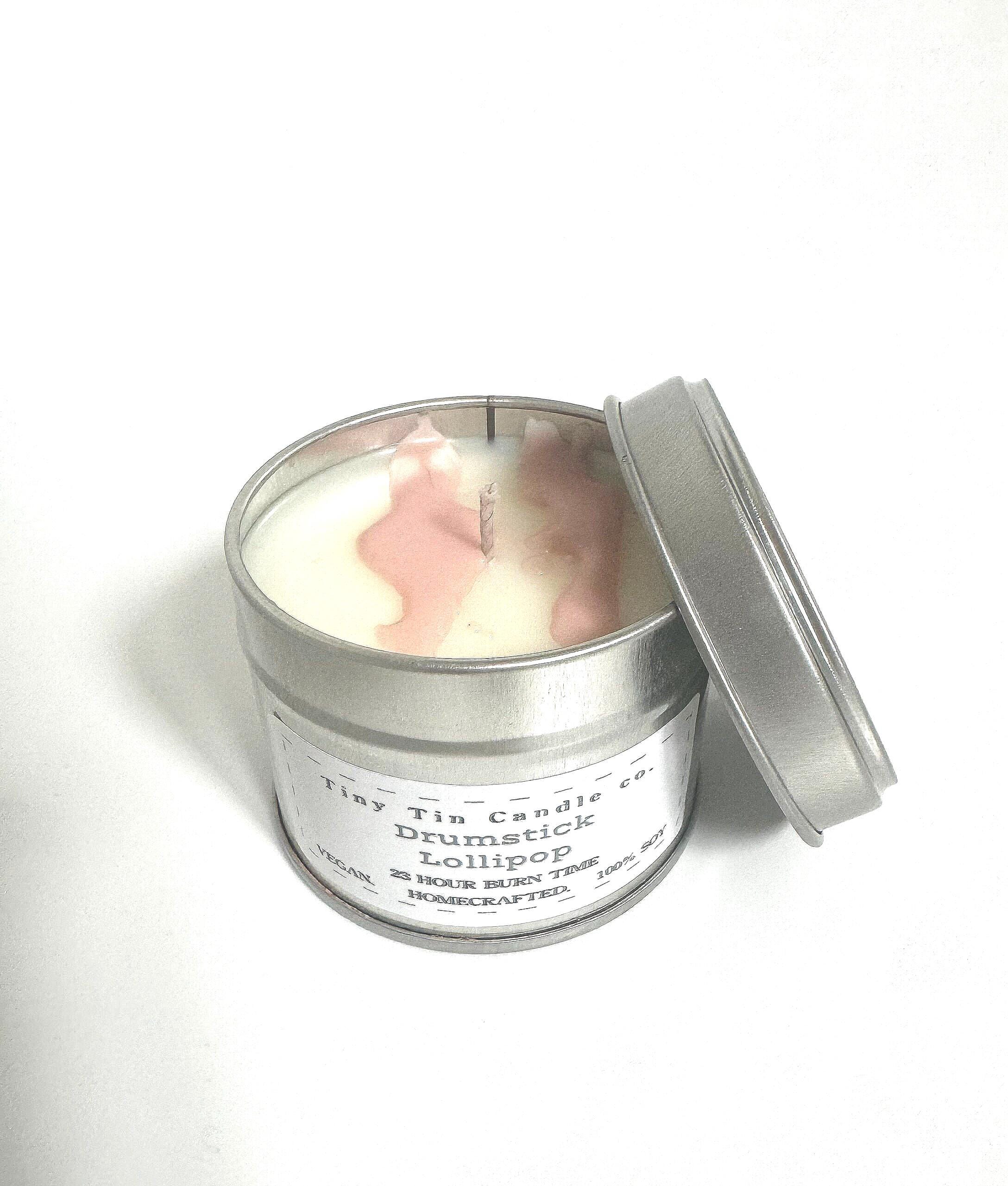 Homemade Candle Drumstick Lollipop Soy Tin Cande 100ml.. Candle on side showing front and bottom of candle 