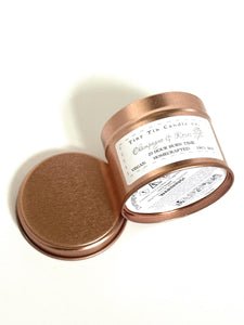Homemade Candle Champagne & Roses Soy Tin Candle 100ml Tin. Candle on side so you can see the bottom and front